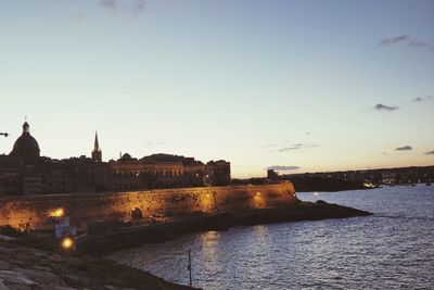 River by city against clear sky