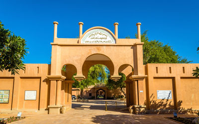 Entrance of temple against building