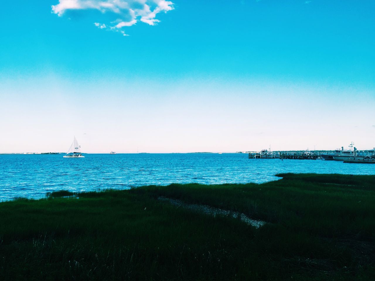 sea, water, blue, nautical vessel, horizon over water, transportation, tranquil scene, tranquility, scenics, mode of transport, beauty in nature, nature, copy space, boat, sky, clear sky, sailboat, day, shore, beach