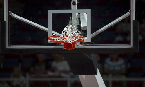 Low angle view of basketball hoop at night