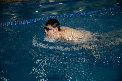 Man swimming in pool