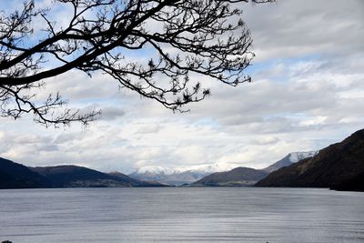 Scenic view of mountains against cloudy sky