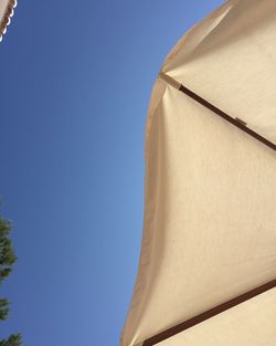 Low angle view of built structure against blue sky