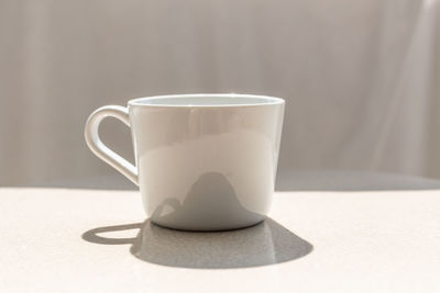 Close-up of coffee cup on table