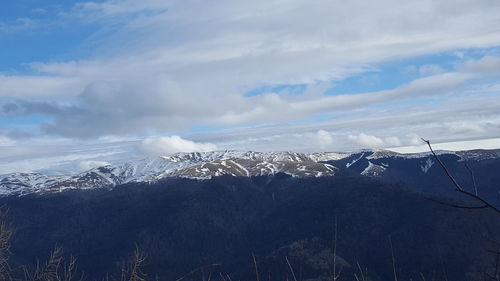 Scenic view of snowcapped mountains against sky