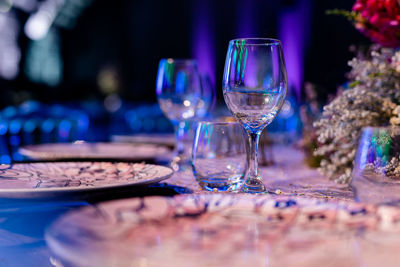 Luxury table settings for fine dining with and glassware, beautiful blurred background. 