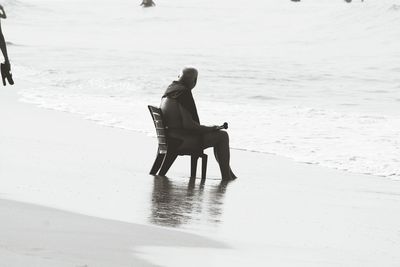 Full length of woman standing on shore