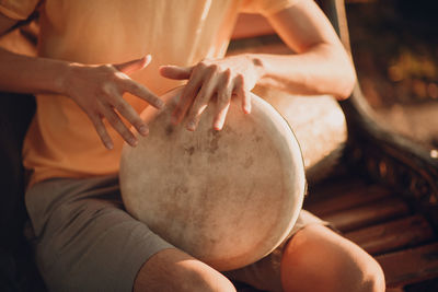 High angle view of man playing drums