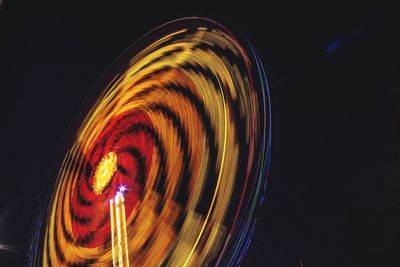 Low angle view of light trails at night