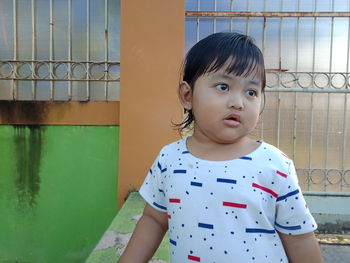 Portrait of cute girl standing outdoors