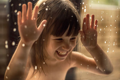 Portrait of a smiling girl in bathroom