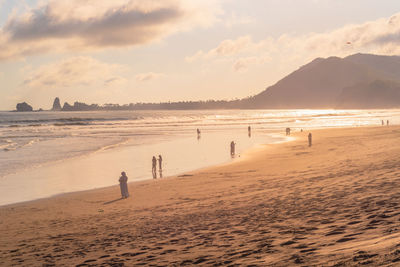 Scenic view of beach against sky during sunset