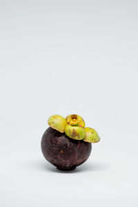 Close-up of fruits against white background