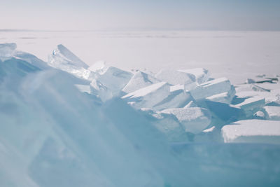 Close-up of frozen sea against sky