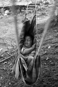 Kids sleeping in swing