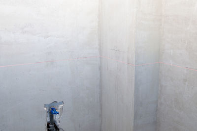 Man working on concrete wall of building