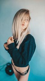 Portrait of a beautiful young woman over white background