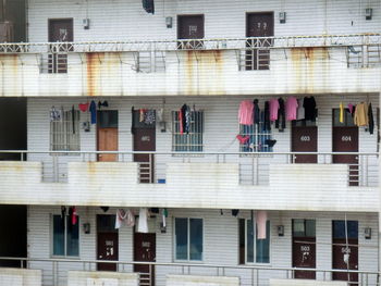 Laundry drying in balconies of residential building