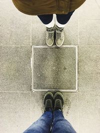 Low section of woman standing on floor