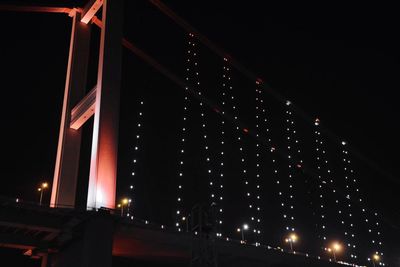 Low angle view of illuminated city at night