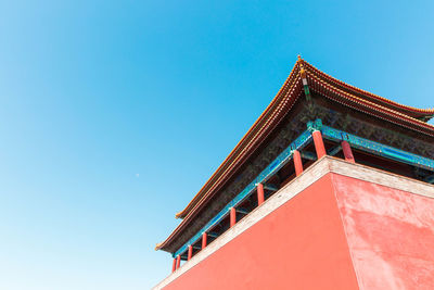 Low angle view of building against blue sky