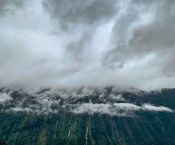 Scenic view of clouds over mountains