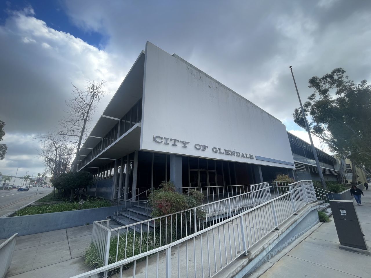 architecture, built structure, facade, cloud, building exterior, sky, headquarters, stadium, sport venue, nature, convention center, city, building, arena, business, outdoors, no people, tree