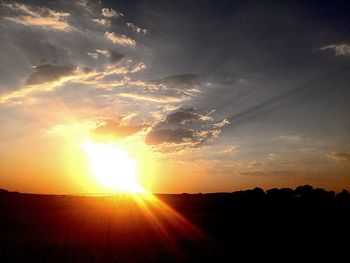 Sun shining over landscape