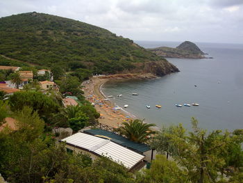 High angle view of beach against mountain range