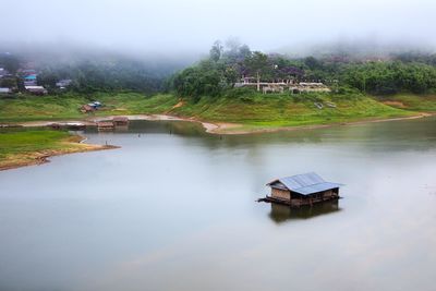 High angle view of abandoned hut in lake