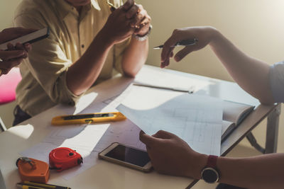 Businessmen working at desk in office