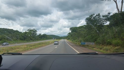 View of road against cloudy sky