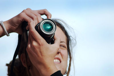 Midsection of woman photographing