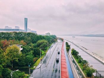 High angle view of city street against sky