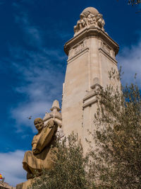 Low angle view of statue against sky