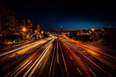 High angle view of light trails on road at night