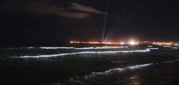 Scenic view of sea against sky at night