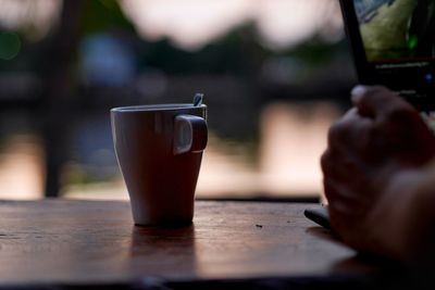 Close-up of coffee cup on table