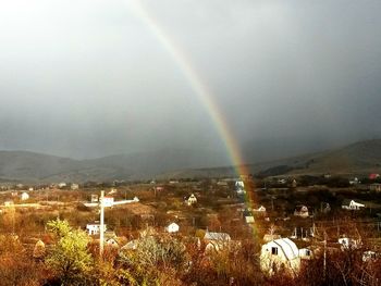 Scenic view of rainbow over field