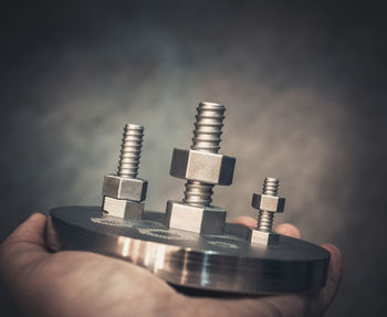 Close-up of hand holding chess pieces