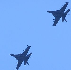 Low angle view of airplane flying in sky