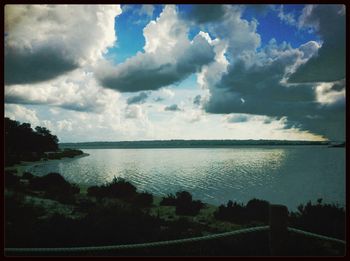 Scenic view of sea against cloudy sky