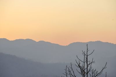 Scenic view of silhouette mountains against clear sky