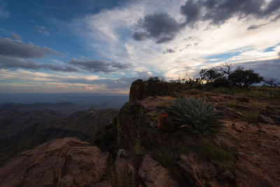 Scenic view of rocky mountains against sky during sunset