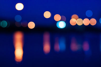 Defocused image of illuminated lights at night