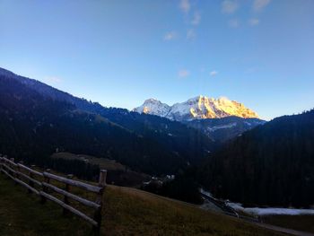 Scenic view of snowcapped mountains against sky