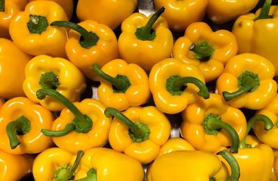 Full frame shot of yellow bell peppers for sale in market