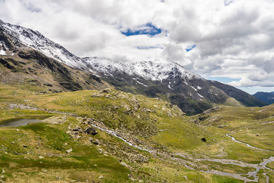 Scenic view of snowcapped mountains against sky