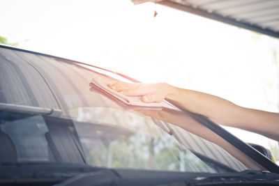 Midsection of woman in car