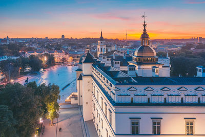 Aerial view of townscape against sky during sunset